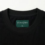 black t shirt front neck label close up