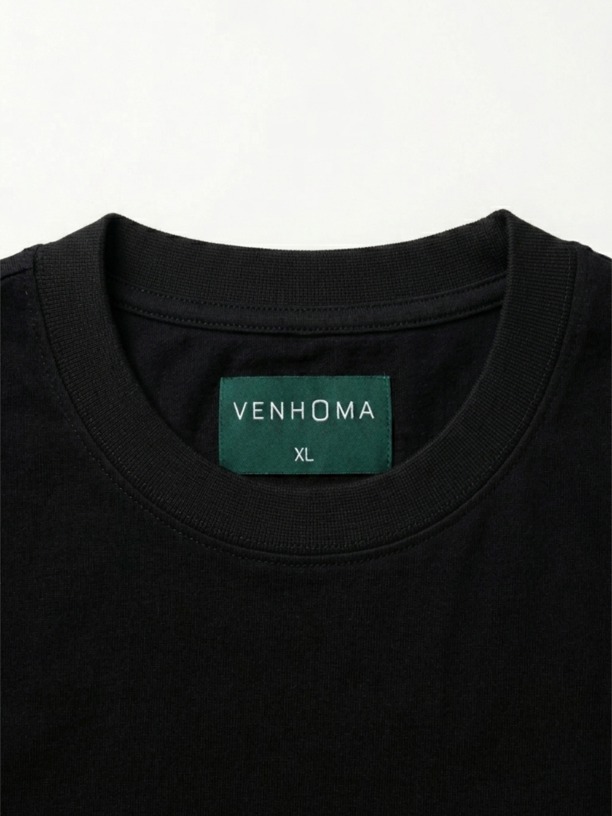black t shirt front neck label close up
